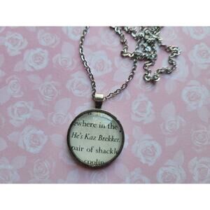 He's Kaz Brekker pendant necklace made with Six of Crows book pages